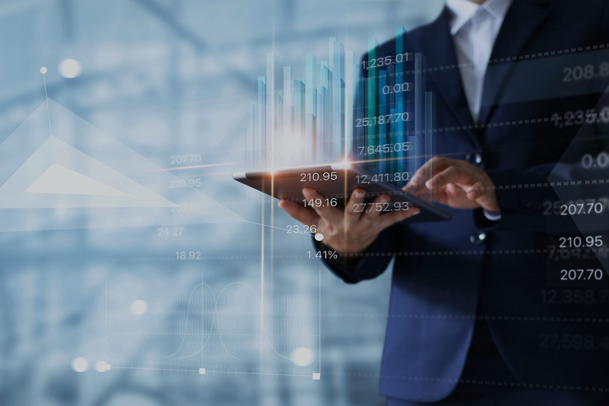 Professional analysing market data on a tablet