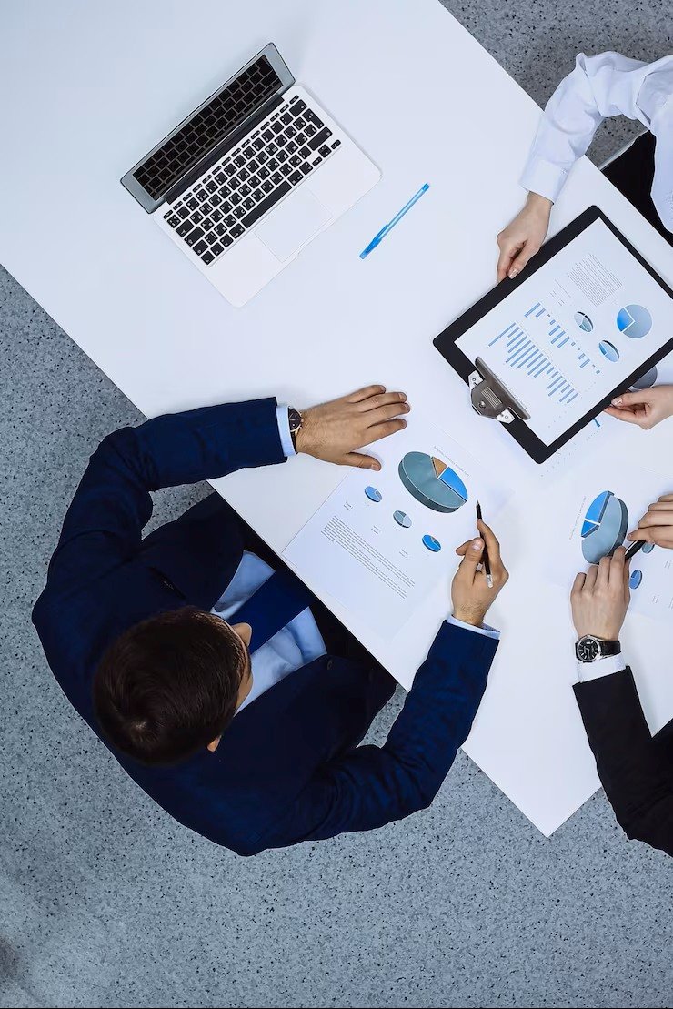 Group business people analyzing financial documents view from business team meeting 665183 4786